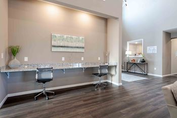 A room with a long table and chairs.